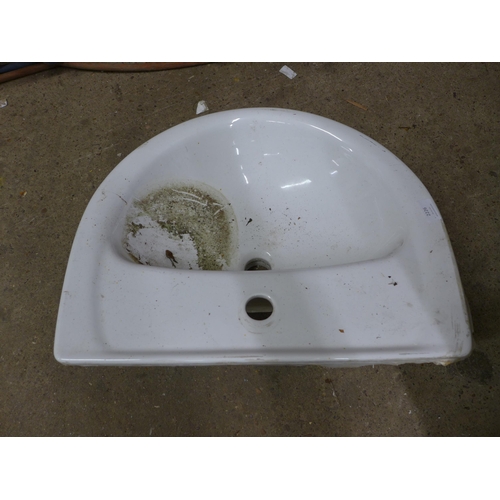 2226 - A used white ceramic hand wash basin