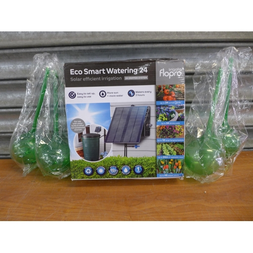 A Flopro Eco Smart Watering "24" solar powered irrigation pump (used) and 5 Plant Drip Feed Watering Spheres