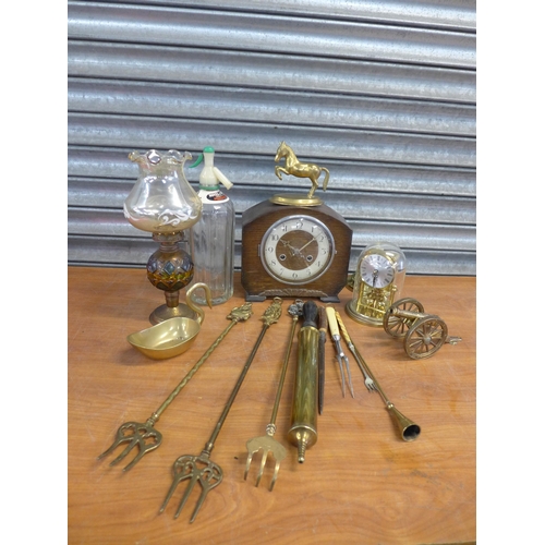A box of assorted brassware, mantel clocks, glassware, fireplace tools etc.