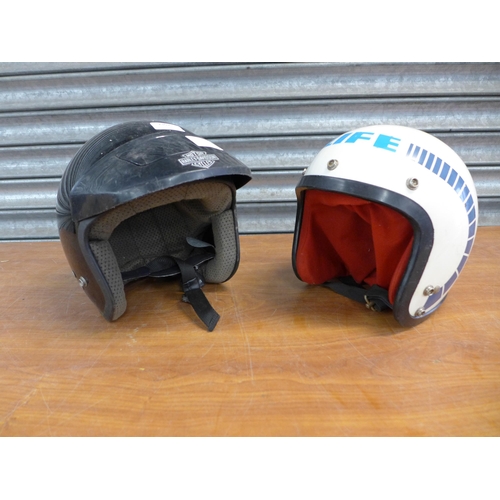 2302 - A Harley-Davidson motorcycle helmet and a BMX life helmet