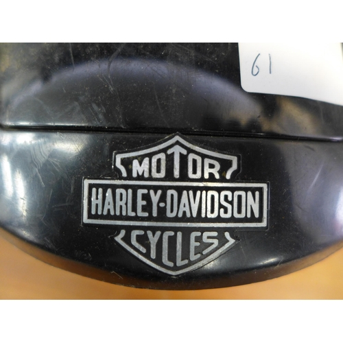 2302 - A Harley-Davidson motorcycle helmet and a BMX life helmet