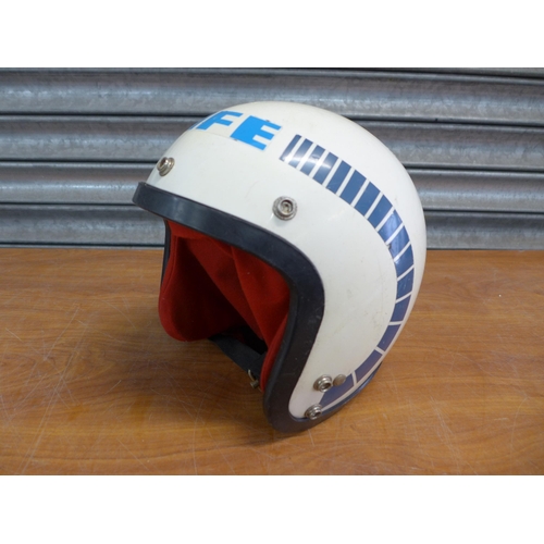 2302 - A Harley-Davidson motorcycle helmet and a BMX life helmet