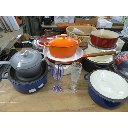 2367 - A collection of assorted cast iron pots and pans including some Le Creuset and a quantity of glasses