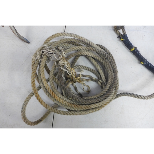 2022 - A small anchor with a length of rope