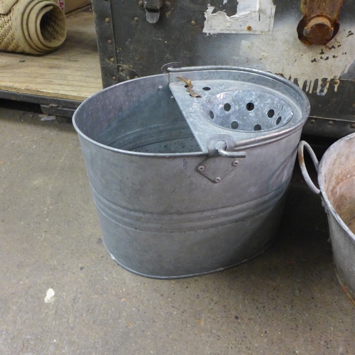 2376 - A U.S.. Army Everwear Trunk and Luggage Co. BC-5 chest, a galvanised mop bucket, cast iron bucket an... 