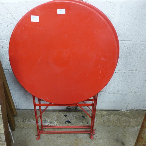 2382 - 2 Red metal folding circular garden tables