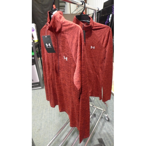 3225 - Two ladies Under Armour 1/2 Zip Tops both size medium. *This lot is subject to VAT