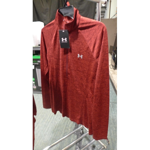 3225 - Two ladies Under Armour 1/2 Zip Tops both size medium. *This lot is subject to VAT