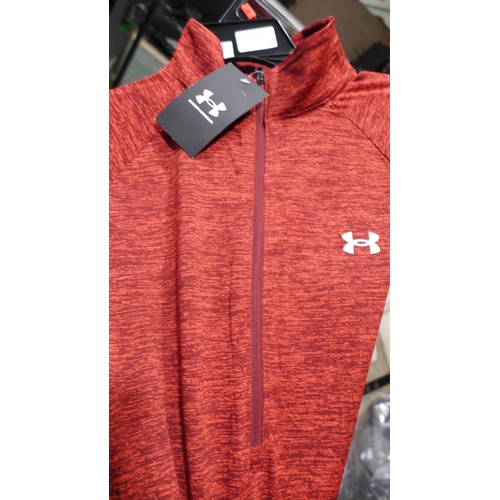 3225 - Two ladies Under Armour 1/2 Zip Tops both size medium. *This lot is subject to VAT