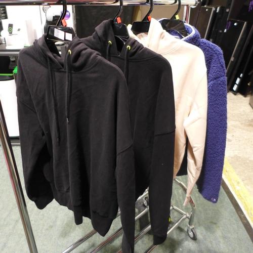 3226 - Four ladies tops inc: DKNY, Fila Hoodies and Champion fleece - mixed sizes. *This lot is subject to ... 