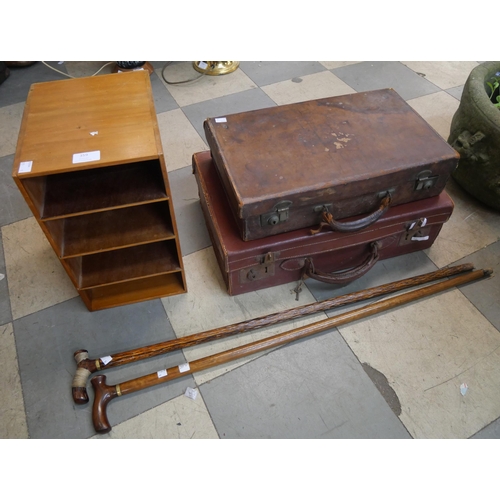 359 - Two leather suitcases, a letter rack and two walking canes