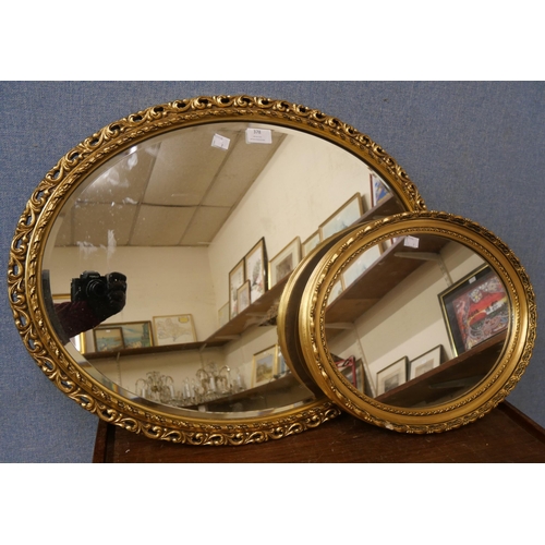 378 - Two oval gilt framed oval mirrors