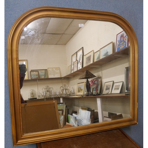 380 - A Victorian style gilt framed overmantle mirror