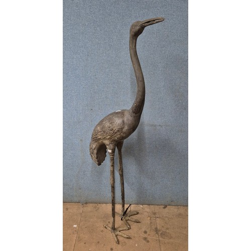 280 - A large bronze garden figure of a crane