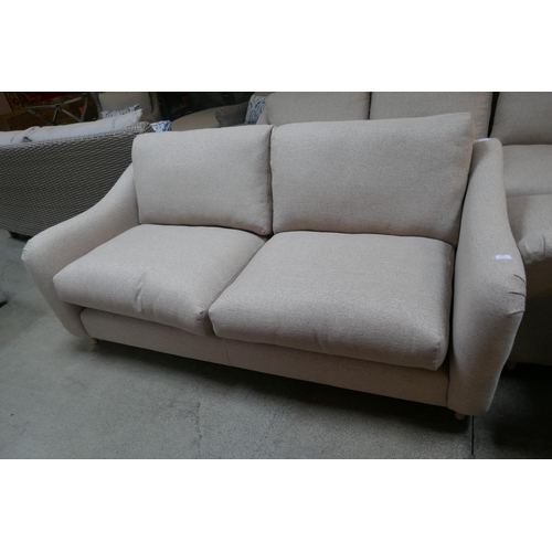 A Hattie oatmeal upholstered three seater sofa