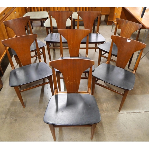 13 - A set of eight teak and black vinyl dining chairs