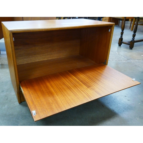 47 - A small teak cabinet