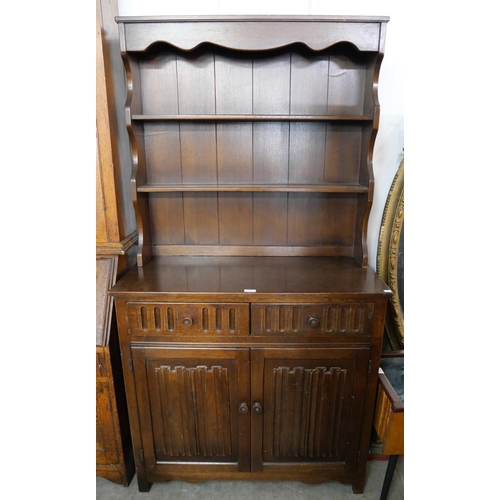 103 - A carved oak linenfold dresser