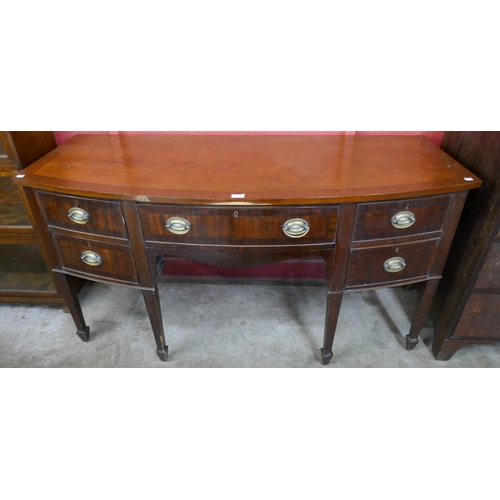 122 - A George III inlaid mahogany bow front sideboard