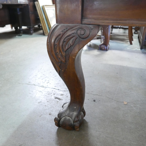 194 - An early 20th Century Queen Anne style mahogany dining table, with additional leaf and winding handl... 