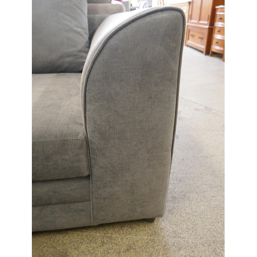 1634 - A grey upholstered corner sofa