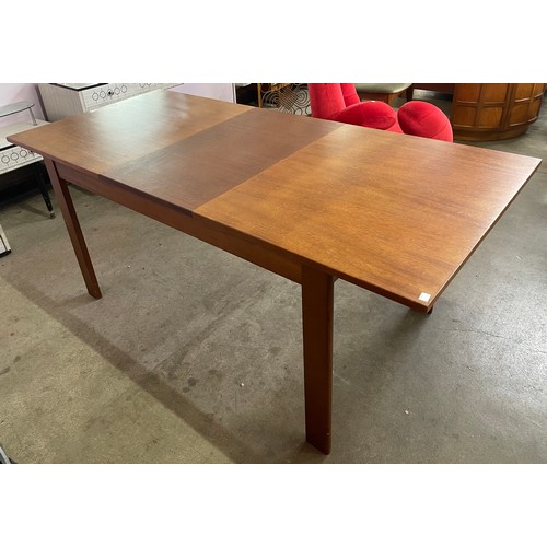 65 - A Danish Mogens Kold teak extending dining table