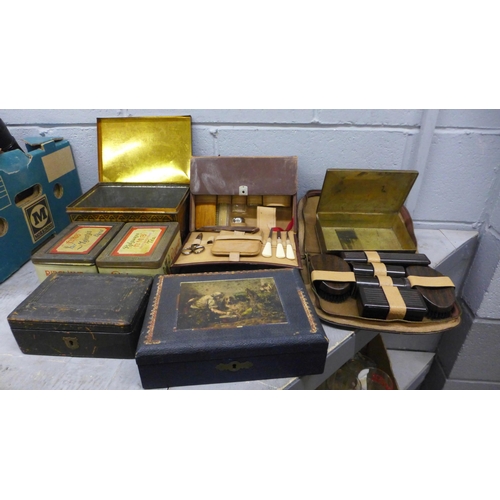 1150 - Two gentleman's travel vanity sets, two Ridgways tea tins, a black tin in the form of a strong box, ... 