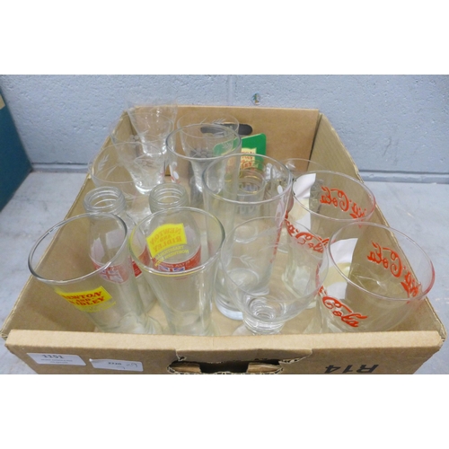 1151 - A box of commemorative and vintage glasses including England Euro 2004, Royal Wedding milk bottles a... 