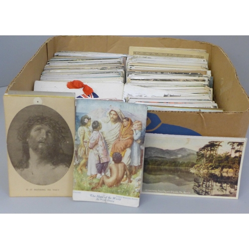 672 - A box containing Edwardian and later postcards, approximately 300