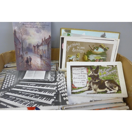 672 - A box containing Edwardian and later postcards, approximately 300