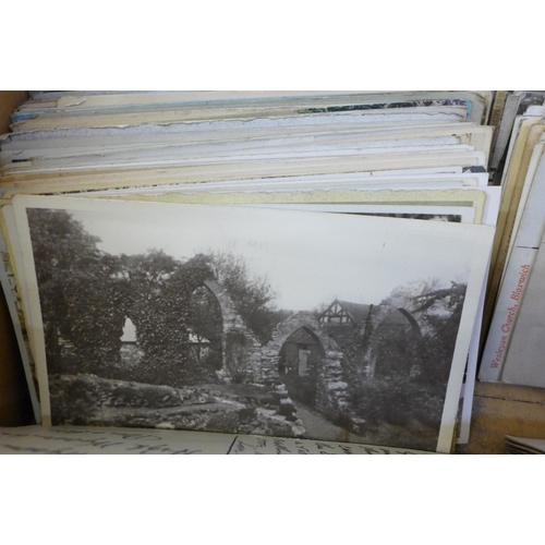 672 - A box containing Edwardian and later postcards, approximately 300