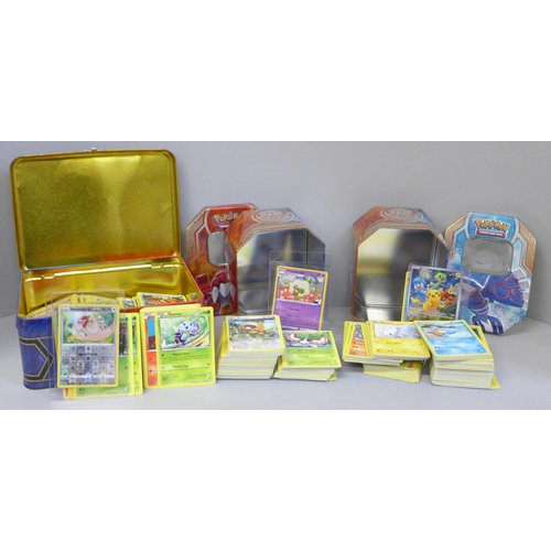 682 - A large quantity of Pokemon cards in collectors tins