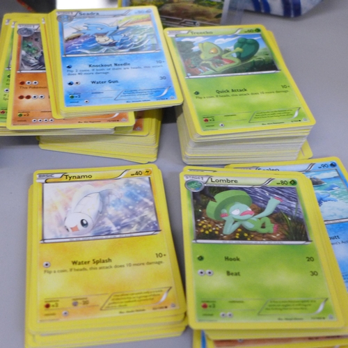 682 - A large quantity of Pokemon cards in collectors tins