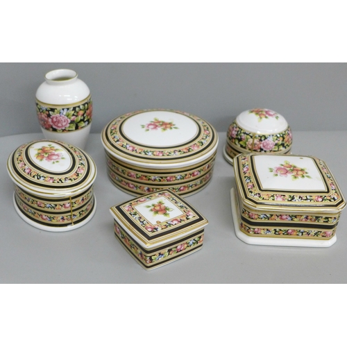 695 - Four Wedgwood Clio lidded pots, paperweight and vase