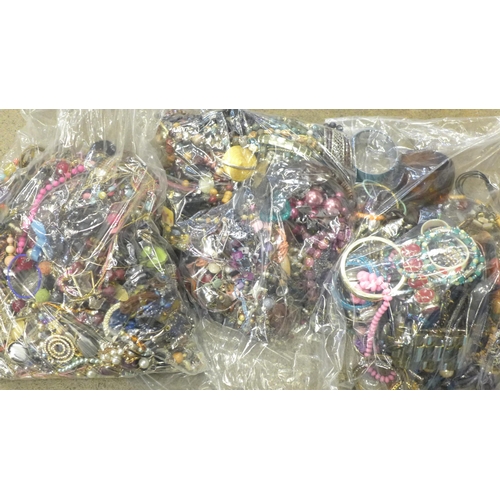 711 - Three large bags of fashion jewellery