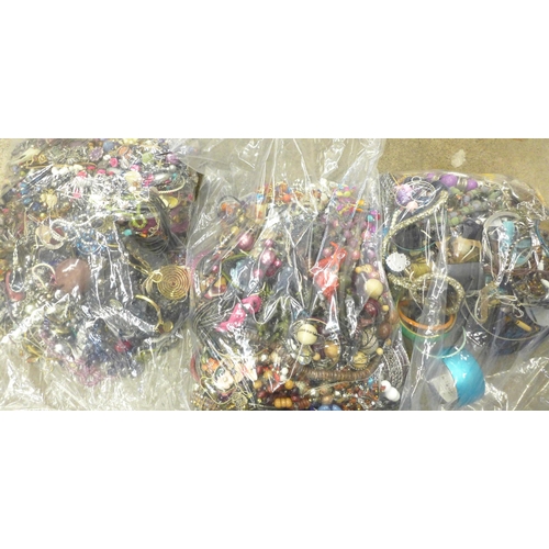 711 - Three large bags of fashion jewellery