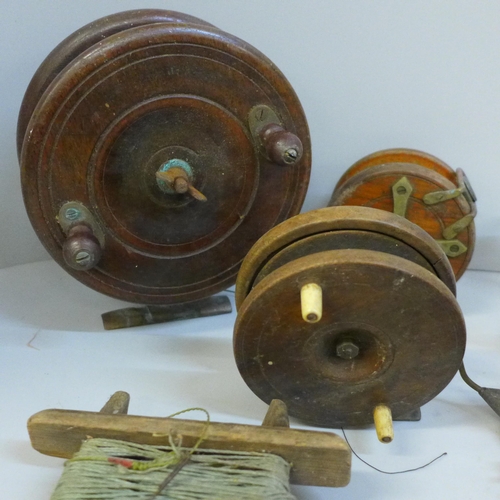 751 - A collection of three early 19th Century vintage (wooden and brass) fishing reels, porcupine quill f... 