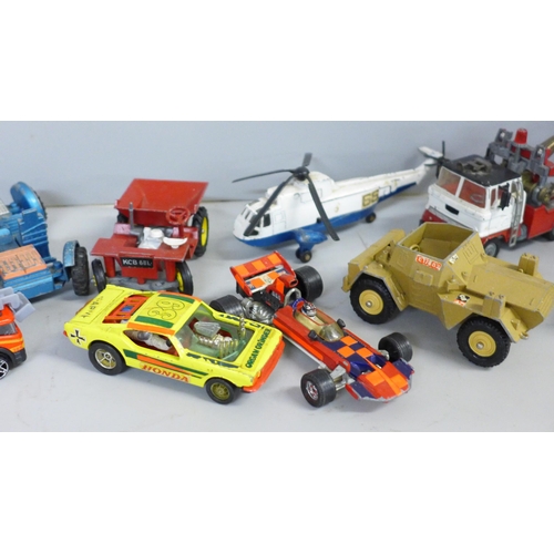 765 - A collection of Dinky, Corgi and Matchbox vehicles, playworn