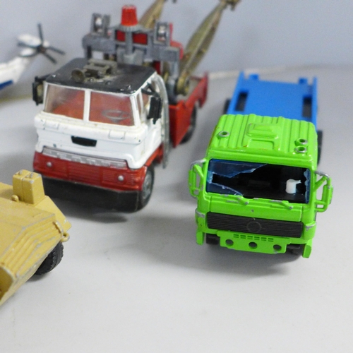 765 - A collection of Dinky, Corgi and Matchbox vehicles, playworn