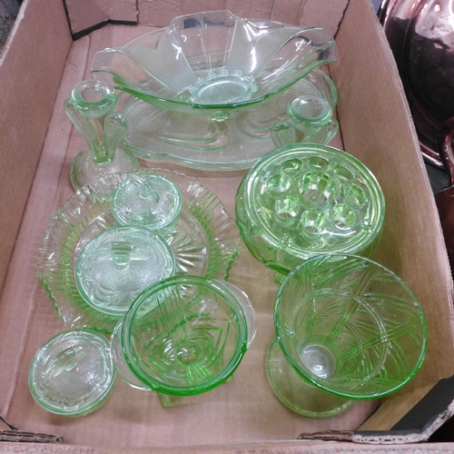 771 - A collection of green glass including a flower frog, dressing table set, vases, etc. (two uranium) *... 