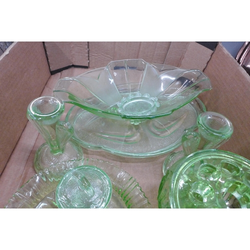 771 - A collection of green glass including a flower frog, dressing table set, vases, etc. (two uranium) *... 