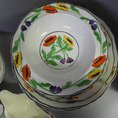 774 - A hand painted Hancocks Ivory ware dinner service; soup dish, gravy boat, plates, side plates, etc. ... 