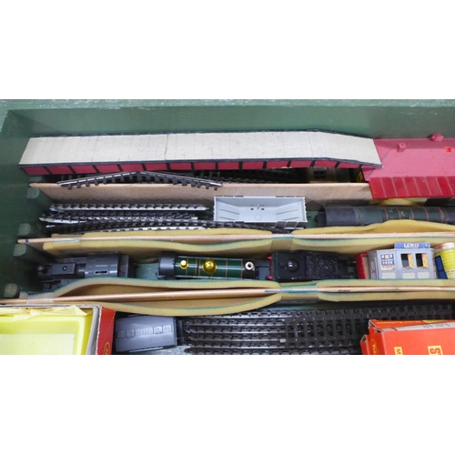 776 - A collection of OO gauge model rail including three locomotives, a clockwork locomotive, track, acce... 