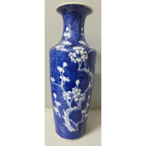 798 - A blue and white Chinese vase with prunus decoration, four character mark to base, 30cm, small repai... 