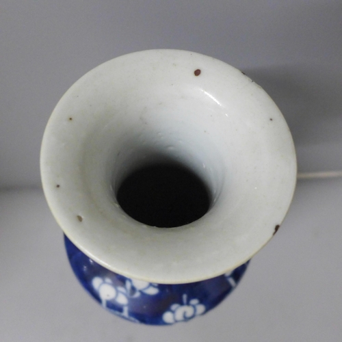 798 - A blue and white Chinese vase with prunus decoration, four character mark to base, 30cm, small repai... 