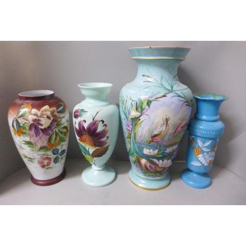 799 - Three hand painted opaline glass vases and one large 19th Century blue glass vase decorated with fla... 