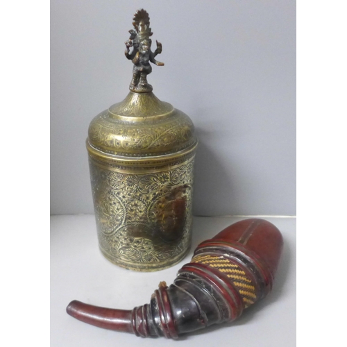 802 - A chase engraved brass Indian lidded caddy with Ganesha top detail, 33cm and a leather powder case w... 