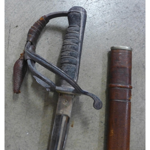 821 - A George V officers sword, with shagreen handle and leather scabbard, the blade marked Woolwich, Roy... 