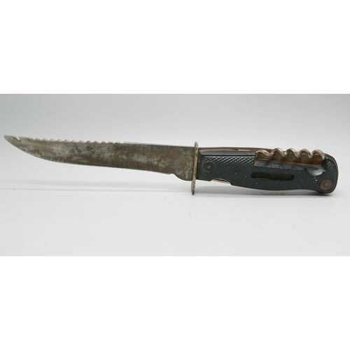 834 - A German Decora, Solingen hunting knife with multitools in hilt, in leather sheath