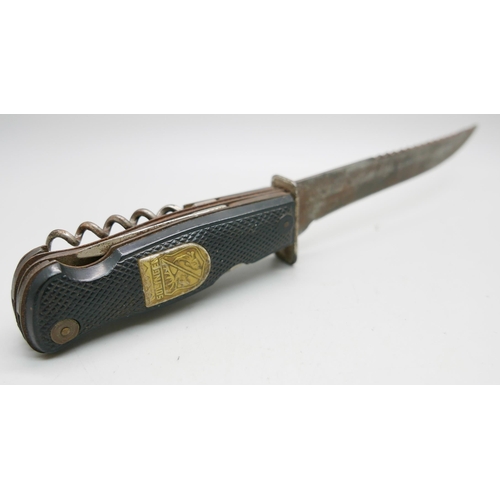 834 - A German Decora, Solingen hunting knife with multitools in hilt, in leather sheath